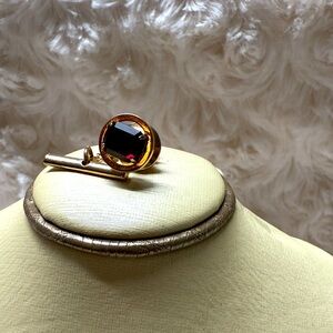 Destino gold filled tie tack pin garnet color stone. Stamped but no kt weight.
